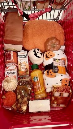 a red shopping cart filled with lots of food and condiments to make it look like halloween