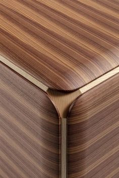 a close up view of the wood grain pattern on this modern piece of art furniture