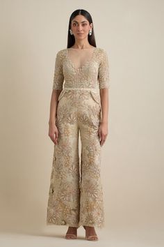 Ivory jumpsuit with all-over cutdana, moti, dabka, sequins, stones resham and crystal embroidery in floral pattern. Comes with shrug style embroidered cropped jacket. - Aza Fashions Fitted Embroidered Jumpsuit For Festive Occasions, Embroidered Fitted Jumpsuits And Rompers For Festive Occasions, Festive Embroidered Fitted Jumpsuits And Rompers, Festive Embellished Floor-length Jumpsuits And Rompers, Festive Floor-length Sequined Jumpsuits And Rompers, Elegant Embellished Festive Jumpsuits And Rompers, Elegant Embellished Jumpsuits And Rompers For Festive Occasions, Elegant Embroidered Jumpsuits And Rompers For Party, Elegant Embellished Jumpsuits And Rompers For Festive Season