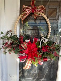 a christmas wreath hanging on the front door