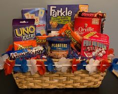 a basket filled with snacks and candy on top of a table