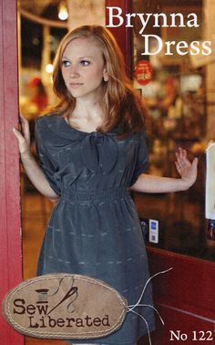 a woman standing in front of a store door