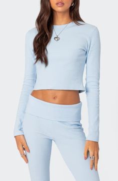 Love to layer in this close-fitting top designed in a cropped silhouette with easy-moving stretch. Crewneck Long sleeves 95% cotton, 5% spandex Machine wash, dry flat Imported Trendy Fitted Cropped T-shirt For Loungewear, Spring Crew Neck Crop Top In Athleisure Style, Spring Crew Neck Athleisure Crop Top, Spring Athleisure Crop Top With Crew Neck, Ribbed Fitted Cropped T-shirt For Spring, Fitted Ribbed Cropped T-shirt For Spring, Fitted Ribbed Crop Top In Elastane, Stretch Elastane Cropped Tops, Fitted Ribbed Elastane Crop Top