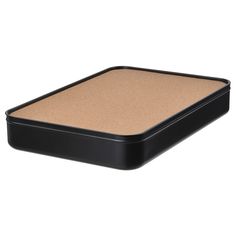 a black box with a cork lid on it and a brown mat in the middle