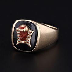 A fascination with the aesthetics of ancient Egypt was popular in the late 1700s through the early 20th century brought about by archeological discoveries and a wave of public curiosity. This vintage onyx ring (circa 1920-1930) features a pharaoh with a carved jasper face and enamel accents. The pharaoh was originally an antique 10k gold tie tack (circa 1920) that our jeweler transformed by removing the tack and riveting it onto the onyx. The face of the ring measures 0.55 inches by 0.45 inches Ancient Ceremonial Hallmarked Jewelry, Vintage Ceremonial Signet Ring With Open Design, Vintage Ceremonial Open Signet Ring, Vintage Onyx Gold Jewelry, Vintage Gold Onyx Jewelry, Ancient Style Yellow Gold Jewelry For Ceremonial Occasions, Vintage Open Ring For Ceremonial Occasions, Gold Art Deco Enamel Ring, Collectible Art Deco Carved Jewelry