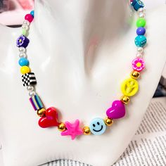 This fun and very original colorful bead necklace a summer necklace mixed with multicolored beads, pearls, and charms is adjustable so you can combine it with other necklaces, it is an excellent gift for a best friend, sister, daughter, mother, etc. The elaborate length of beads and charms is 14 inches and its total length is 35 inches so you can adjust it to the length of your preference ITEM DETAIL Materials: synthetic leather, nylon cord, acrylic beads, gold plated beads, clay beads, pearl Playful Multicolor Beaded Chain Necklace, Funky Multicolor Beaded Necklace, Playful Rainbow Beaded Necklaces, Playful Multicolor Necklace, Rainbow Necklace With Large Beads, Preppy Necklaces, Y2k Necklace, Daisy Necklace, Summer Necklace