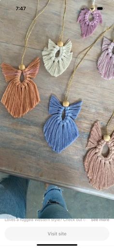 four tasseled necklaces on a wooden table with text overlay that reads,'the best diy crochet projects for your home decor