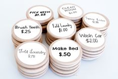 a pile of wooden buttons with words on them