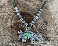 This is a super cute, hand stamped Armadillo. Adorned with a beautiful piece of Turquoise Mountain in his center and a cute little lone star stamped on his hip. He adds the perfect amount of western charm to any look. He hangs from an adjustable black leather strap with a sterling silver slide. Turquoise Bar Necklace, Logo Jewelry, Faith Jewelry, Photo Heart, Lone Star, Necklace Sterling Silver, Silver Turquoise, Organza Bags, Turquoise Stone