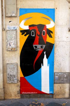 a door with a painting of a bull on it