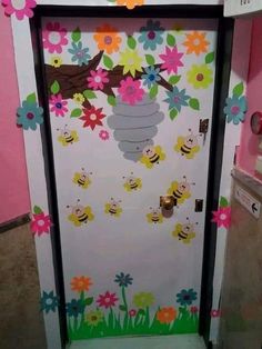 the door is decorated with flowers and bees