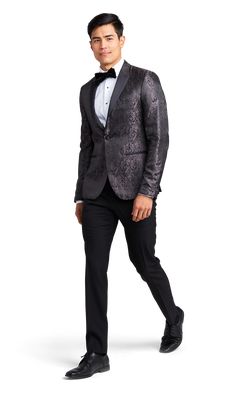 A slim paisley black tuxedo with one button and a peak lapel. All Black Tux, Peak Lapel Tuxedo, Grooms Outfit, Paisley Jacket, Black Tux, Groom Looks, Tuxedo Suit, Black Tuxedo, Groom Outfit