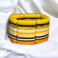 Nwt. Yellow, Orange, White And Black Pattern. Lucite Links. 1.5” Wide Yellow Stretch Bracelet As A Gift, Retro Yellow Adjustable Bracelets, Yellow Retro Bracelet As Gift, Black Pattern, Orange White, Stretch Bracelet, Yellow Orange, Stretch Bracelets, Womens Jewelry Bracelets