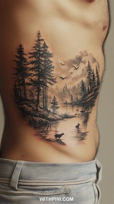 a man's chest with a forest scene on it