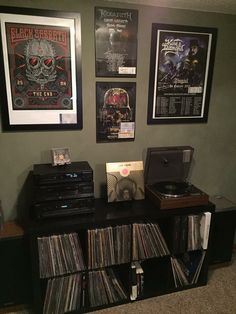 an entertainment center with records, vinyls and cds