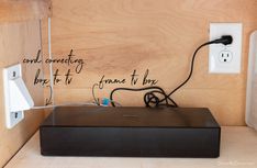 an electronic device is plugged into the wall with words written on it that read, end connecting box to frame they