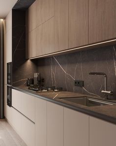 a kitchen with marble counter tops and wooden cabinetry, along with a sink in the middle