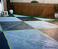 an outdoor patio that has been painted with yellow tape