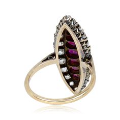 a gold ring with purple stones on it