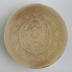 a small bowl with designs on it