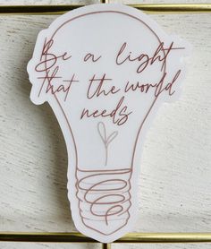 a light bulb with the words be a light that the world needs