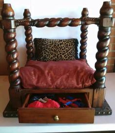 an old wooden bed has been turned into a storage bench