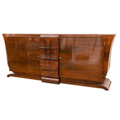 an art deco sideboard with three drawers and one door on the front, in walnut