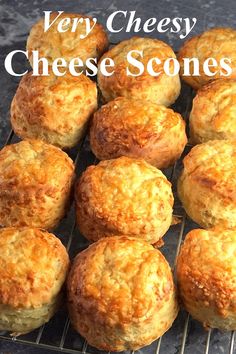 some very tasty looking scones sitting on a rack with the words, very cheesy cheese scones