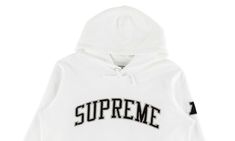 The Supreme Raiders ‘47 Hoodie is part of a collaborative assortment that launched with the Supreme Spring/Summer 2019 collection.  On the front of the cotton hooded sweatshirt is a Supreme logo across the chest.  A large Raiders logo flanks the back and an AFC logo appears on the left arm.  The hoodie is appropriately shaded in white, black, and silver Raiders colors.  With an overwhelming number of white hoodies on the market, this particular one should be a no-brainer for Raiders fans and anyone who likes the team's rebel spirit. Raiders Logo, Supreme Logo, Raiders Fans, Stadium Goods, The Supreme, Summer 2019, Black And Silver, White Hoodie, Hooded Sweatshirt