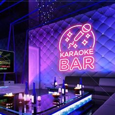 the karaoke bar is lit up with neon lights