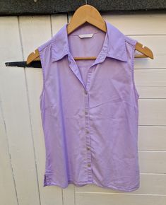 "90s Y2K semi fitted lilac sleeveless shirt By Marks and Spencer Size UK10 US6 lightweight soft easy wear summer blouse Measurements: Pit to pit 18\" Length 24\" Waist 15\" across Fabric: lyocell Spare button attached All orders are shipped using biodegradable and recycled packaging where possible" Summer Purple Shirt With Button Closure, Purple Button-up Shirt For Summer, Summer Purple Button-up Shirt, Casual Lavender Blouse For Summer, Casual Lavender Shirt For Summer, Casual Lavender Summer Shirt, Lavender Cotton Shirt For Summer, Purple Cotton Sleeveless Blouse, Sleeveless Purple Cotton Blouse