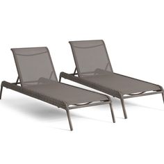 two lounge chairs sitting next to each other