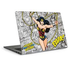 an image of a laptop with wonder woman on the screen and comic characters all over it