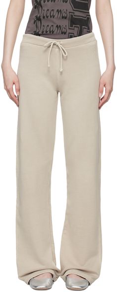 Loose-fit organic cotton French terry lounge pants. · Low-rise · Drawstring at rib knit waistband · Logo embroidered at front · Raw edge at pinched side seams Supplier color: Stone Paloma Wool, Sleepwear & Loungewear, Color Stone, Actor Model, Lounge Pants, Raw Edge, Paloma, Logo Embroidered, French Terry