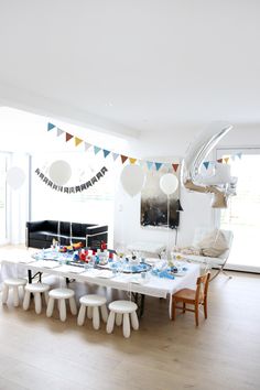 a dining room table set up for a birthday party