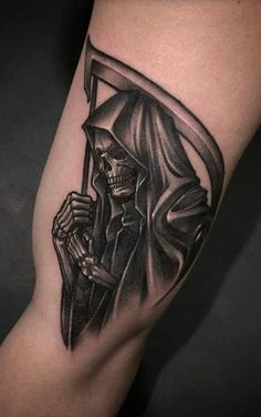 a black and white tattoo of a skeleton holding a sculler on his arm