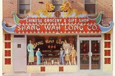 an old photo of a chinese shop front