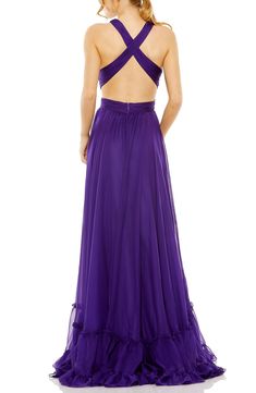 A regal shade of royal purple adds to the striking statement made by this A-line gown designed to show some skin and finished with a wide frill. 61" length Back zip closure V-neck Lined 100% polyester Spot clean Imported Asian Owned/Founded Designer Formal Dresses, Long Formal Dress, Floor Length Prom Dresses, Pleated Bodice, Prom Girl, Mac Duggal, A Line Gown, Royal Purple, Tier Skirt