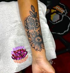 a person with a flower tattoo on their arm