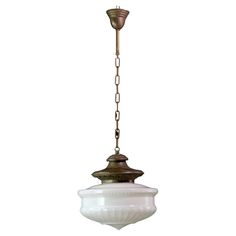 an old fashioned light fixture hanging from a chain on a white background with clippings