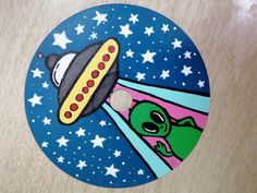 a sticker with an image of a spaceship flying through the sky and aliens in space