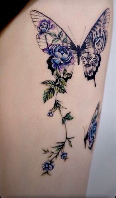 a woman's thigh with a butterfly and flowers on it