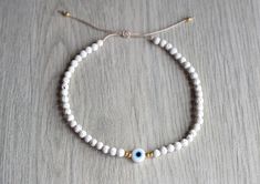 Evil eye beaded bracelet/anklet- Beach anklet - Beach bracelet - Surf bracelet Adjustable beach anklet made white lava beads, gold seed beads and evil eye charm Slim style made with 4mm beads Many sizes available at checkout Ready to use for swimming, waterproof Ready to give as a gift this beach bracelet comes wrapped in a cute gift bag Price is for one piece. How to order: Please measure your wrist/ankle tight then select your size from the drop-down menu. Consider that the pictures may vary s White Evil Eye Beaded Bracelets For Festivals, White Evil Eye Round Beads Friendship Bracelets, White Evil Eye Bracelets For Festival, Festival White Evil Eye Bracelets, Beach Resizable Evil Eye Bracelet With Round Beads, White Beaded Evil Eye Bracelet For Beach, Adjustable Evil Eye Bracelets For Beach, White Beaded Evil Eye Bracelet, Adjustable White Evil Eye Bracelet