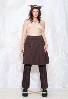 Get funky with this Y2K vintage cargo skirt! Embrace the gorpcore meets grungey vibes! Features: - four pockets - button closure - 100% cotton Every item we manage is cleaned and, when necessary, repaired, ensuring it arrives to you in top condition. Our model, Sawa is 170 cm / 66.3" tall and she's a size XXL. Size: XL / US 10 / UK 14 / IT 46 Other size info: Labelled size: 42 Measurements:  waist (seam to seam): 45 cm / 17.6" length: 58 cm / 22.6" Fabric: cotton 100% Care: Machine wash inside o 2000s Midi Skirt, Get Funky, Cargo Skirt, Pleated Midi Skirt, Style Expert, Label Sizes, Y2k Vintage, Fabric Cotton, Vintage Y2k