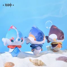 three stuffed animals sitting in the sand with bubbles coming out of their mouths and eyes