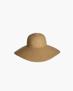 Made from partially recycled materials, our patented Squishee® straw has a classic look you will love. This sustainable product of man-made materials looks and feels like authentic raffia straw and is more durable than a hat made of natural fiber. If you have been searching for a woman's designer packable hat for sale, this is a style you will use for many years to come. Bella rolls and folds into a tote bag for travel and will emerge wrinkle-free when unpacked. Eric Javits' Squishee® hats are k Classic Solid Color Sun Hat For Beach, Brimmed Straw Hat, Classic Beach Sun Hat, Classic Brown Straw Sun Hat, Solid Color Straw Panama Hat With Curved Brim, Eco-friendly Toquilla Straw Hat, Casual Solid Straw Hat, Solid Straw Hat For Vacation, Classic Palm Leaf Hats For The Beach