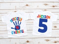 two children's shirts with the number 5 and handprinted numbers on them