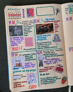 an open notebook with stickers and pictures on the pages, including words in english