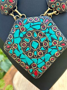 Vintage Tibetan turquoise and coral inlaid in brass. Adjustable length from 18"-20". Very nice vintage condition. Traditional Blue Patina Necklace, Traditional Turquoise Inlay Necklace As Gift, Traditional Turquoise Necklace With Inlay For Gift, Handmade Turquoise Brass Necklace, Unique Turquoise Brass Necklaces, Artisan Gold Turquoise Necklace For Festival, Artisan Turquoise Necklace In Gold For Festival, Vintage Turquoise Necklace For Festival, Traditional Multicolor Necklace With Inlay