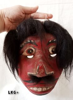 "🌸The price listed is for 2 masks🌸 * This is a unique mask that comes from Dieng, Central Java.  This mask is about 10 years old.  Made of quite thick wood. *Mask size:  - Large: approx. 16 cm x 18 cm (6.3\" x 7.1\")  - Small: approx. 15 cm x 19 cm ( 5.9\" x 7.5\")  This unique mask is very beautiful to decorate your living room wall or is unique and beautiful as a gift. 🌸 Thank you🌸" Artistic Red Masks And Prosthetics For Festivals, Red Masks And Prosthetics For Festivals, Red Masks And Prosthetics For Costume Festivals, Traditional Red Masks And Prosthetics For Costume, Red Costume Masks For Festivals, Traditional Red Costume Masks And Prosthetics, Traditional Masks And Prosthetics For Festivals, Traditional Festival Masks And Prosthetics, Handmade Traditional Mask